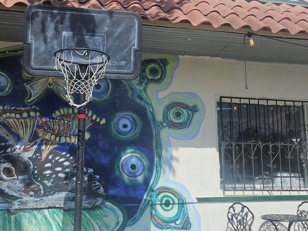 The mural wall and patio beside Midtown